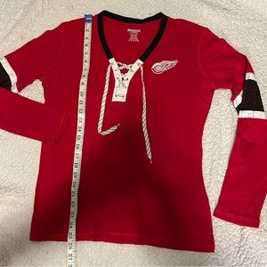 Reebok Detroit Red Wings shirt. Woman’s Large
